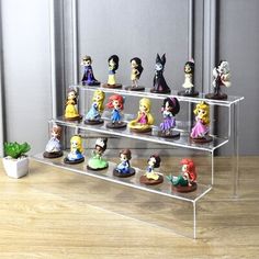 there are many figurines on the shelf