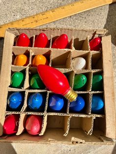 an open cardboard box filled with plastic toys