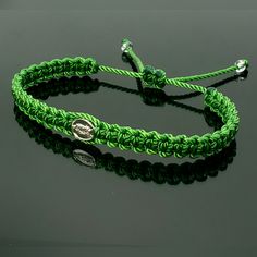 Fashionable And Durable Hand-Made Green String Bracelet With A Virgin Mary Charm For Wrist Sizes From 6 To 9 In. With An Easy To Use Zip Like Function To Fit Your Wrist, You'll Have It On As Soon As You Get It. Made From High-Quality Green String, It Will Be Sure To Last. Each Bracelet Is Carefully Handcrafted And Given Proper Time To Ensure Quality. Elegant Adjustable Green Friendship Bracelets, Green Adjustable Jewelry For Friendship, Casual Green Jewelry With Adjustable Length, Casual Green Adjustable Jewelry, Green Friendship Bracelets With Sliding Knot, Adjustable Green Bracelets, Green Resizable Beaded Bracelets, Symbolic Adjustable Green Bracelets, Green Beaded Jubilee Bracelet