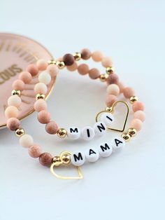 Life would be boring without mamas, and they're minis! This bracelet set celebrates that sweet bond. Style: Stretchy for ease in wearing and comfort - Tiny heart charm bangle on each bracelet Mama bracelet is adult sized Mini bracelet is toddler/young child-sized . Mama And Mini, Kids Charm Bracelet, Mama Bracelet, Mini Bracelet, Baby Bracelet, Gold Bead Bracelets, Tiny Heart, Stone Gold, Charm Bangle