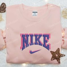 Pink Purple Nike Logo Embroidered Shirt, Nike Inspired Embroidered Hoodie, Best Gifts For Family Welcome to Tinicloset, where we’ve mastered the art of blending style, passion, and individuality into every stitch, and where fashion enthusiasts who adore Nike and the captivating hues of pink and purple find their sartorial haven. We specialize in crafting custom embroidered shirts, sweatshirts, T-shirts, and hoodies, each meticulously designed to elevate your wardrobe and make a statement. Pink Long Sleeve Hoodie With Embroidered Logo, Pink Hoodie With Letter Embroidery For Streetwear, Pink Hoodie With Embroidered Text For Winter, Trendy Crew Neck Hoodie With Embroidered Logo, Pink Letter Embroidery Hoodie For Streetwear, Pink Long Sleeve Hoodie With Embroidered Text, Winter Pink Hoodie With Embroidered Text, Pink Custom Embroidery Sweatshirt For Streetwear, Pink Long Sleeve Hoodie With Custom Embroidery