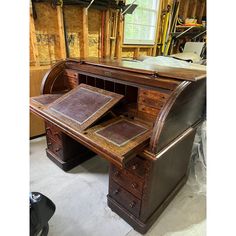 an old wooden desk in a garage