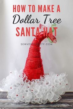 a santa hat made out of yarn on top of a white sign that says how to make a dollar tree santahat