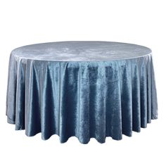 a round table covered in blue velvet