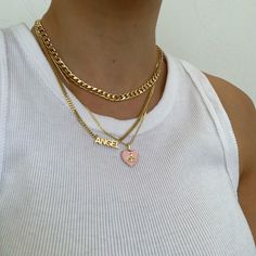 This baby is absolutely heavenly! With its adorable cherub on a pink heart, this dainty necklace is guaranteed to make any outfit that much cuter. Pair this one with the matching Pondering Angel Earrings to complete this heavenly set! Pink Pendant Charm Necklace, Pink Pendant Charm Necklace With Delicate Chain, Dainty Pink Charm Necklace With Delicate Chain, Pink Dainty Necklace For Mother's Day, Pink Heart Pendant Charm Necklace For Mother's Day, Dainty Pink Charm Necklace For Mother's Day, Pink Heart Charm Necklace For Mother's Day, Personalized Pink Heart Charm Necklace, Trendy Pink Charm Necklace