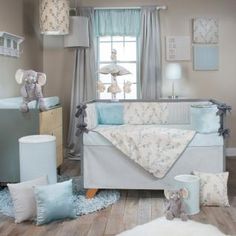 a baby's room with blue and white decor