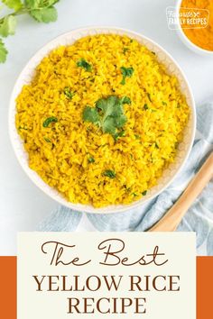 the best yellow rice recipe in a white bowl with cilantro and parsley