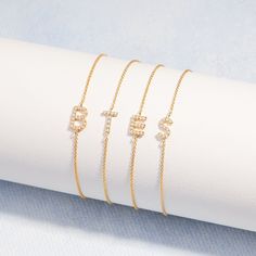 A statement of style, this Blaire Diamond Initial Bracelet will add a touch of sparkle to any look. Showcasing a single shimmering diamond-encrusted initial, this sleek and sophisticated piece of jewelry is sure to turn heads. Available in sterling silver or 14k gold vermeil 6" cable chain with 1" extender Initial size: 3/8" tall, width varies Lobster claw closure 1mm diamonds This is an uppercase only font, lowercase letters entered will be produced as uppercase This item is FINAL SALE SKU: BYB Elegant Personalized Diamond Bracelets, Luxury Personalized Diamond Bracelet, Personalized Silver Diamond Bracelet, Elegant Formal Bracelet With Initials, Elegant Personalized Cubic Zirconia Bracelets, Elegant Cubic Zirconia Jewelry With Initials, Formal Initials Jewelry With Cubic Zirconia, Elegant Monogrammed Cubic Zirconia Jewelry, Formal Initials Jewelry In Cubic Zirconia