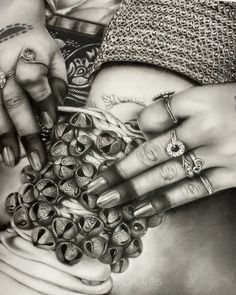 a drawing of two hands with rings on their fingers