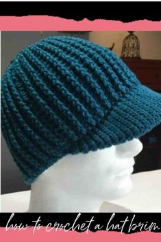 a knitted hat is shown on top of a mannequin's head