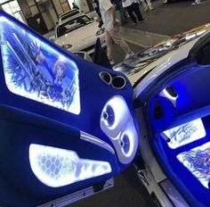 the interior of a futuristic car with blue lights