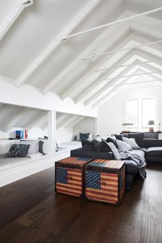 a living room filled with furniture and an american flag box on top of the coffee table