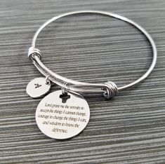 "Serenity Prayer Bracelet Personalized Initial Bangle Bracelet! A round charm printed with Serenity Prayer beginning with \"Lord grant me the serenity\" on a stainless steel expandable bangle bracelet makes the perfect gift for you or a loved one. God, grant me the serenity to accept the things I cannot change, Courage to change the things I can, And wisdom to know the difference. The religious bracelet charm is made from stainless steel and measures 24 mm by 24 mm. The bible verse bracelet is h Inspirational Adjustable Round Jewelry, Inspirational Round Adjustable Jewelry, Stainless Steel Charm Bracelet For Friendship, Stainless Steel Round Charm Bracelet For Friendship, Friendship Stainless Steel Charm Bracelet, Inspirational Jewelry For Friendship, Nickel-free Charm Bracelet For Friendship, Spiritual Round Stainless Steel Bracelets, Nickel-free Round Charm Bracelet For Friendship