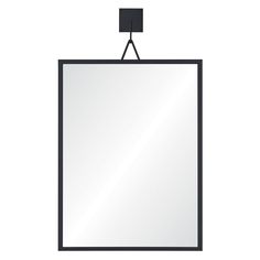 a mirror hanging on the wall with a black frame and square shaped object attached to it