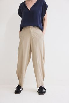 The devil is in the details. These tapered pants have a relaxed fit. Made with our iconic Core nylon fabric, these pants feel like loungewear. Click here for Petite Fit Solid Tapered Leg Parachute Pants For Fall, Solid Harem Pants Loosely Fitted For Workwear, Oversized Solid Pants For Workwear, Oversized Workwear Pants With Elastic Waistband, Oversized Workwear Pants, Oversized Pants For Workwear, Solid Parachute Pants With Elastic Waistband And Tapered Leg, Loosely Fitted Harem Pants With Pockets For Workwear, Spring Workwear Parachute Pants With Tapered Leg