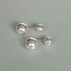 A pair of sterling silver ball studs. The small ball can be inserted into the big ball for closure. Dimensions: Small ball: 8mm Big ball: 12mm. Length: 21mm Weight: 3.60gm Price listed is for a PAIR of hoops. These earrings are made of 925 hypoallergenic sterling silver Can be packaged in a gift box. I can include a personal message from you if needed You are welcome to contact me at... bhavnakwintra1956@gmail.com For more beautiful pieces from my shop, please browse 👇 TOE RINGS: https://www.et Classic Silver Internally Threaded Cartilage Earrings, Classic Silver Internally Threaded Piercings, Modern Silver Internally Threaded Cartilage Earrings, Modern Internally Threaded Silver Earrings, Everyday Silver Earrings Internally Threaded, Everyday Sterling Silver Piercings, Silver Piercings With Matching Earrings, Elegant Silver Piercings For Everyday, Classic Silver Hypoallergenic Plug Earrings