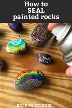 someone is painting rocks with the words how to seal painted rocks on top of them