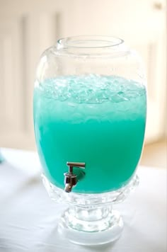 a blue liquid in a glass container on a table