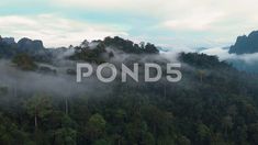 Birds eye view of cloudy mountain tops in early morning, Thailand, Khao Stock Footage #AD ,#cloudy#mountain#Birds#tops