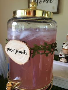 a pink drink in a large glass jar