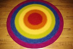 a multicolored round rug on the floor