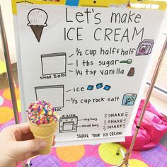 an ice cream sign in front of a child's play area