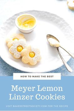 lemon linzer cookies on a white plate with a bowl of butter and spoons