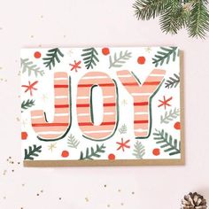 a christmas card with the word joy on it