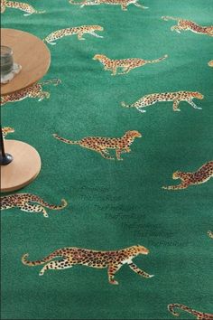 a green rug with cheetah on it