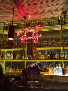 the neon sign above the bar says no time for fendereyes on it's wall