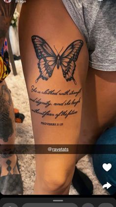 a woman's leg with a butterfly tattoo on it and the words, she is clothed