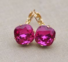 "Gorgeous new earrings using genuine Swarovski elements. The rhinestone is cushion cut and fucshia in color. It is hot pink and measures 12mm (1/2\"). Stones are hand set into premium earring settings. Earrings have a lever back ear wire soldered to the back. Or, you can choose post style earrings, which will have a hypoallergenic post located in middle back. Studs measure 1/2\" around, while lever back ear 1\" long. Shown in gold, but also come in silver or antique brass. Please choose desired Rose Gold Statement Earrings, Cushion Earrings, Hot Pink Earrings, Pink Tourmaline Crystal, Pageant Earrings, Pink Cushions, Dark Rose, Wedding Jewelry Earrings, Crystal Drop Earrings