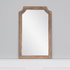 a mirror hanging on the wall above a door