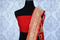 Ethnic red georgette Banarasi sari is perfect for a striking Indian look at weddings and festive occasions. The saree has an overall zari work and zari buta which makes it absolutely rich. It comes with a matching red blouse piece. Shop online at Pure Elegance or visit our store in USA! Disclaimer: The actual product may vary slightly from the image. These are custom orders, hence expect slight variation in color, placement of the motif or buta. ESTIMATED DELIVERYBecause this is a custom order, Red Banarasi Silk Lehenga With Sheer Dupatta, Designer Red Choli With Zari Weaving, Red Banarasi Silk Saree With Sheer Dupatta, Red Banarasi Silk Saree For Reception, Reception Banarasi Silk Red Saree, Red Dupatta With Zari Weaving For Reception, Red Georgette Pre-draped Saree With Zari Weaving, Red Pre-draped Georgette Saree With Zari Weaving, Georgette Banarasi Saree