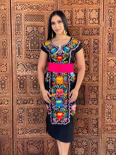 -This Beautiful Long Mexican Colorful Floral Dress is the perfect dress for a fun night out or a special event. -It is full of colorful embroidered flowers and has some crocheted details. -This dress has ties on the back in order to adjust the fit. - You can purchase the dress either with or without the belt. Please note: The accesories shown with this dress may purchased as well and Can be found in this links Earrings:https://www.etsy.com/es/listing/855938626/aretes-mexicanos-de-filigrana-arete Fitted Pink V-neck Embroidered Dress, Pink Fitted V-neck Embroidered Dress, Pink Short Sleeve Embroidered Dress For Party, Pink Embroidered Midi Dress For Party, Fitted Short Sleeve Embroidered Midi Dress, Pink Embroidered Fitted Midi Dress, Pink Fitted Embroidered Midi Dress, Multicolor Embroidery Short Sleeve Party Dresses, Knee-length Dresses With Multicolor Embroidery