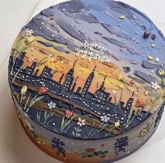 a cake decorated with an image of a city