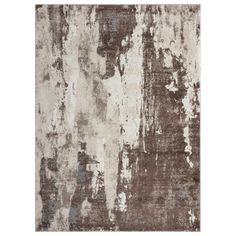 an area rug that has been painted with brown and white paint on the wall,