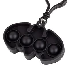 an egg tray with six eggs in it and a black plastic holder on the side