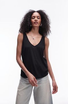 Made from lightweight jersey, this V-neck tank has a slouchy fit that's great for layering or letting the breeze in on hot days. V-neck 50% viscose, 50% polyester Machine wash, line dry Imported Casual Viscose V-neck Top For Summer, Casual V-neck Top In Viscose For Summer, Summer Modal Tops For Layering, Modal Cami Tops For Summer, Stretch Viscose Tank Top For Summer, Chic Summer Modal Tank Top, Versatile Modal Tops For Summer, Black Modal Tops For Summer, Casual Stretch Viscose Tank Top