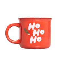 an orange coffee mug with the words oh hoo on it and pine branches in white letters