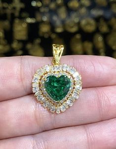 Vintage 18K Solid Gold Emerald & White Topaz Heart Pendant...Marked 18K... Total of weights 4.6grams. Measure includes the Bail H 1 1/8'' W 6/8''....Measure of stone 10 x 10MM...It's in very good condition. Heart Cut Cubic Zirconia Jewelry For May Birthstone, Heart-shaped Emerald Jewelry For Valentine's Day, Valentine's Day Heart Shaped Emerald Jewelry, Yellow Gold Heart Cut Dazzling Jewelry, Dazzling Yellow Gold Heart Cut Jewelry, Dazzling Heart Cut Yellow Gold Jewelry, Gold Heart Cut Emerald Jewelry, Gold Emerald Heart Pendant Jewelry, Emerald Wedding Jewelry For Valentine's Day