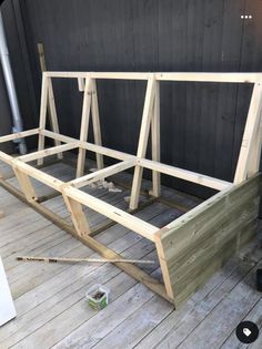 a wooden frame sitting on top of a wooden floor