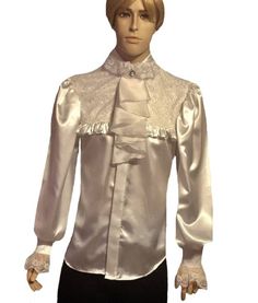 "Men's dress shirt with hidden buttons band and Club style ruffled collar with one covered button at the neck band. A lace bib embellished with satin ruffles. Has plastic buttons at the buttons band, shaped hem and detachable 100% silk Satin Organza Jabot. Wide Extra Long Puff Sleeve shirt. Standard Cuffs style with 2 buttons and lace Ruffles. Shaped hem.  -  Please, take a look at the last picture for available colors      Mannequin Height- 6.2 Feet Fabric:  Charmeuse Satin - 100% Polyester, ma Formal Satin Blouse With Buttons, Elegant Formal Blouse With Ruffled Collar, Elegant Formal Lace Blouse, Formal Fitted Blouse With Ruffled Collar, Classic Formal Blouse With Pearl Buttons, Classic Formal Blouse With Lace Trim, Elegant Party Blouse With Pearl Buttons, White Satin Blouse For Formal Occasions, Classic Lace Blouse For Formal Occasions