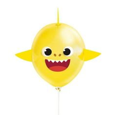 a yellow balloon with a smiling face on it