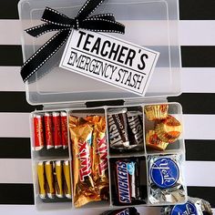 a teacher's emergency stash box filled with candy bars and hersheys