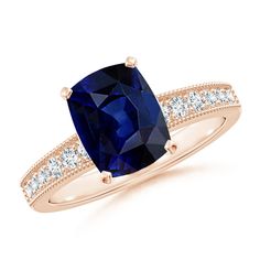 a cushion cut blue sapphire and diamond ring in 18k rose gold with side stones