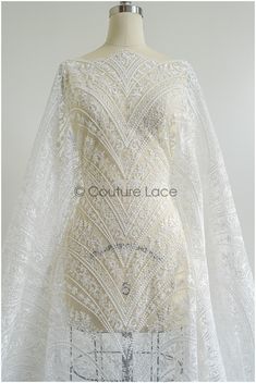 Very romantic bridal lace fabric with beautiful floral design. Perfect for bridal dresses or christening gowns  ❀❀ DETAILS ❀❀  Color: off-white Yarn: rayon Mesh: nylon Sequins: yes Beads: no 3D Flowers: No  ❀❀ MEASUREMENTS ❀❀  Listed/ price per 1yds (0,91 Meter) Width of embroidery - width of full fabric: 139cm /54.7" Please note, that we only sell by full yards (yds). We don't sell half yards or any other quantity.  ❀❀ SAMPLE SWATCH ❀❀  If you want to check the color and quality, you can order Elegant White Embroidered Fabric With Scalloped Lace, Fitted Embroidered Lace Fabric For Wedding, Fitted Embroidered Lace Wedding Fabric, Fitted Delicate Lace Embroidered Fabric For Wedding, Delicate Lace Embroidered Wedding Fabric, White Fitted Lace Veil, White Wedding Dress With Scalloped Lace, White Scalloped Lace Wedding Dress For Ceremony, White Wedding Dress With Scalloped Lace For Ceremony