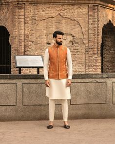 This item is made specially for you by hands with love  Item Contains:  Kruta  Vest and  Pants  Fabrics :   Luxury silk  Colours :  Cream kurta pyjama & Orange vest  Style and Designs :  Kurta has mandarin collar and long sleeves with a full button placket symmetric hem up to knee and multiple slits Vest coat has mandarin collar and five button placket with straight cut bottom design has two pocket with bone and it is hand embroidered with dabka golden dabka work all over embroidery motifs  Trou Engagement Suits, Mendhi Outfit, Coat And Pants, Mehndi Outfit, Wedding Kurta, Indian Groom Wear