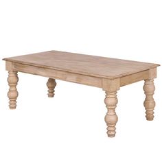 a wooden table sitting on top of a white floor