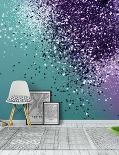 an artistic wallpaper with glitter in purple and teal tones is featured against a blue background